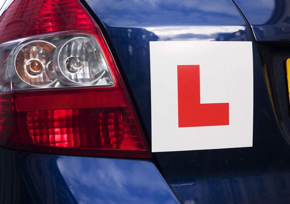 Car with L plate